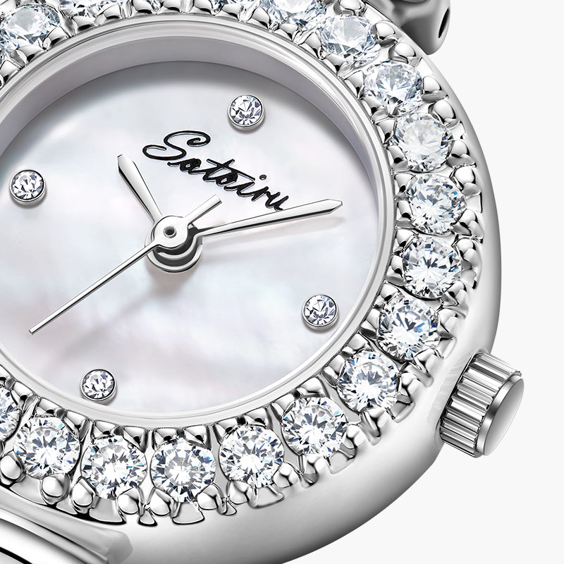 Close-up of Sotoiru mother-of-pearl dial with zircon bezel