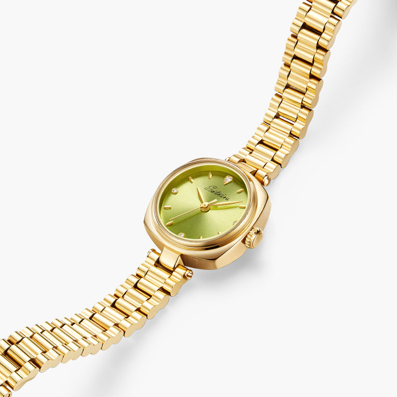 Close-up of Sotoiru Pistachio Aura watch with jewelry-inspired bracelet